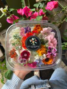 Container of edible flowers